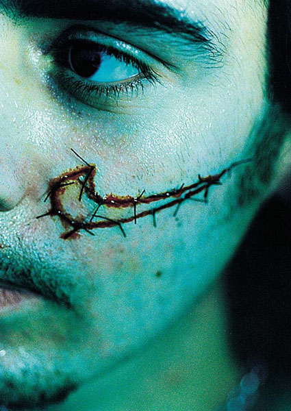 A boy with a Nike Swoosh stitched into his face